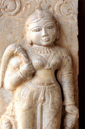 India Jaipur sculpture in an hindu temple; representation of a woman; maybe a deva; round face and voluptuous shapes Stock Photo - Budget Royalty-Free & Subscription, Code: 400-05006914