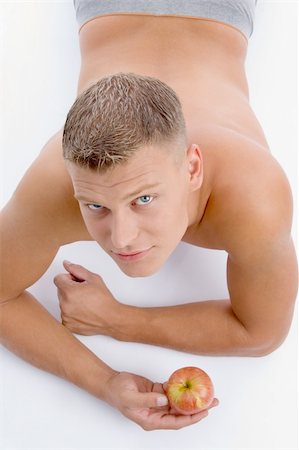 simsearch:400-05082999,k - high angle view of muscular man with apple on an isolated white background Stock Photo - Budget Royalty-Free & Subscription, Code: 400-05007283