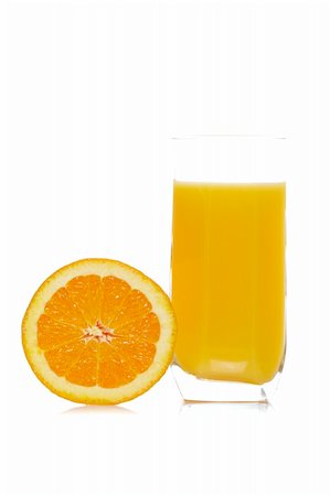 simsearch:400-04618236,k - A half and glass of fresh orange juice reflected on white background. Shallow depth of field Stockbilder - Microstock & Abonnement, Bildnummer: 400-05007555