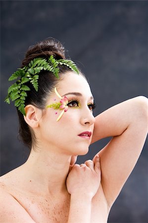 petal on stone - Beautiful brunette face with pink green yellow eye flower petal makeup, isolated on gray Photographie de stock - Aubaine LD & Abonnement, Code: 400-05007937