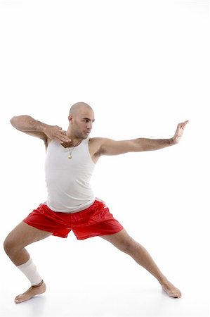 simsearch:400-05082999,k - male in fighting pose against white background Stock Photo - Budget Royalty-Free & Subscription, Code: 400-05008194