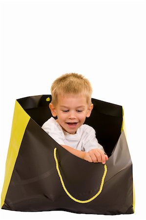 simsearch:400-04001701,k - An adorable three year old playing with a shopping bag, isolated on white. Stock Photo - Budget Royalty-Free & Subscription, Code: 400-05008207