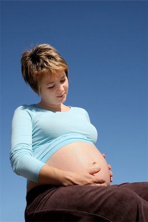 simsearch:400-08529613,k - A pregnant young woman sitting outdoors Stock Photo - Budget Royalty-Free & Subscription, Code: 400-05008271