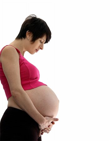 simsearch:400-08529613,k - A pregnant young woman standing holding her belly Stock Photo - Budget Royalty-Free & Subscription, Code: 400-05008306