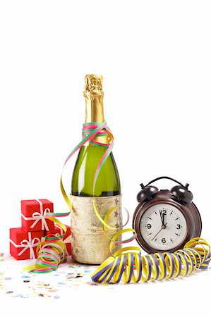 simsearch:400-05082002,k - Clock and champagne bottle with gifts, ribbons and confetti for Happy New Year celebration Photographie de stock - Aubaine LD & Abonnement, Code: 400-05009179