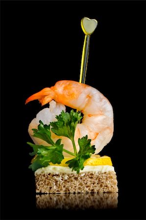 delicious canape with boiled shrimp, isolated on black Stock Photo - Budget Royalty-Free & Subscription, Code: 400-05009287