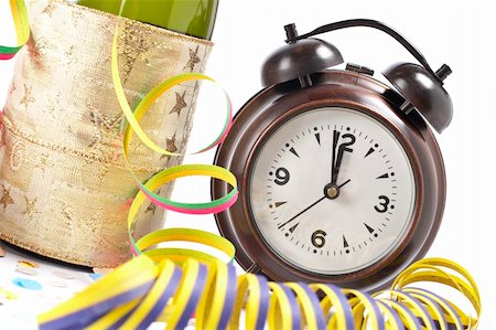 simsearch:400-05082002,k - Waiting the New Year with champagne bottle and clock. Shallow depth of field Photographie de stock - Aubaine LD & Abonnement, Code: 400-05009686