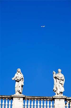 st peters church rome italy - White classical statue of St. Peter's Basilica in Vatican and flying air in blue sky, Rome, Italy Stock Photo - Budget Royalty-Free & Subscription, Code: 400-05009777