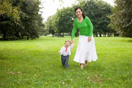 simsearch:400-08787277,k - happy family playing in park Stock Photo - Budget Royalty-Free & Subscription, Code: 400-05000099