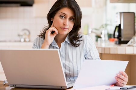 Woman in kitchen with laptop Stock Photo - Budget Royalty-Free & Subscription, Code: 400-05000467