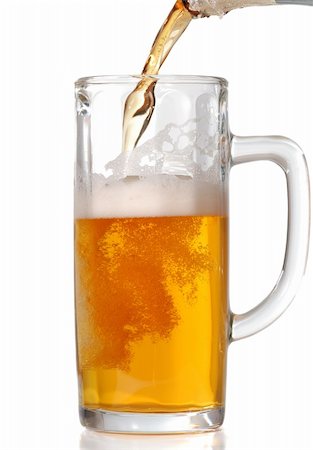 simsearch:400-04893684,k - Beer mug isolated on white. Pouring beer in it. Stock Photo - Budget Royalty-Free & Subscription, Code: 400-05000738