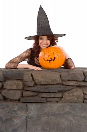 simsearch:400-04007612,k - Portrait of Hispanic teenager girl in black Halloween hat and fishnet dress with carved pumpkin (Jack O' Lantern) Stock Photo - Budget Royalty-Free & Subscription, Code: 400-05001107