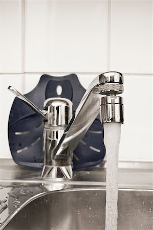 simsearch:400-04026996,k - Chrome tap in the kitchen with flowing water Stock Photo - Budget Royalty-Free & Subscription, Code: 400-05001294