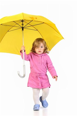 rain little girl - beauty a little girl with yellow umbrella Photographie de stock - Aubaine LD & Abonnement, Code: 400-05001529