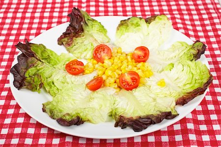 simsearch:400-04864579,k - Salad with lettuce, tomatoes and corn on square mat. Shallow depth of field Stock Photo - Budget Royalty-Free & Subscription, Code: 400-05001535