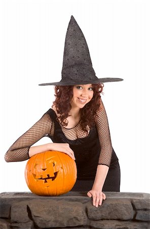 simsearch:400-04028019,k - Portrait of busty Hispanic teenager girl in black Halloween hat and fishnet dress with carved pumpkin (Jack O' Lantern) Foto de stock - Super Valor sin royalties y Suscripción, Código: 400-05002050