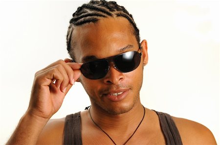 simsearch:400-04539832,k - Portrait of young trendy african man wearing sunglasses - isolated Foto de stock - Royalty-Free Super Valor e Assinatura, Número: 400-05002251