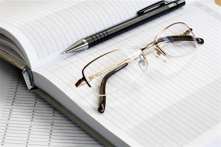 simsearch:400-04592928,k - gold glass, black pencil  and white blank notebook Stock Photo - Budget Royalty-Free & Subscription, Code: 400-05002308