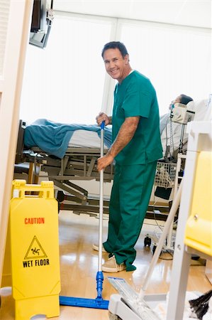 An Orderly Mopping The Floor In A Hospital Ward Stock Photo - Budget Royalty-Free & Subscription, Code: 400-05003263