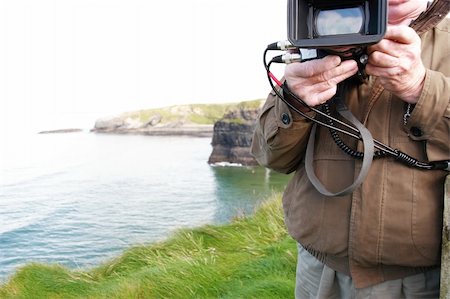 a cameraman filming on the cliff edge in ballybunion ireland Photographie de stock - Aubaine LD & Abonnement, Code: 400-05003559