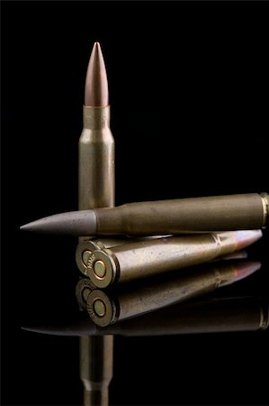 simsearch:700-02377111,k - AK47 Rifle Ammunition on Black Photographie de stock - Aubaine LD & Abonnement, Code: 400-05003936