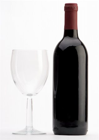 simsearch:400-04935153,k - A Bottle of red wine with a wine glass on a plain background Photographie de stock - Aubaine LD & Abonnement, Code: 400-05014081