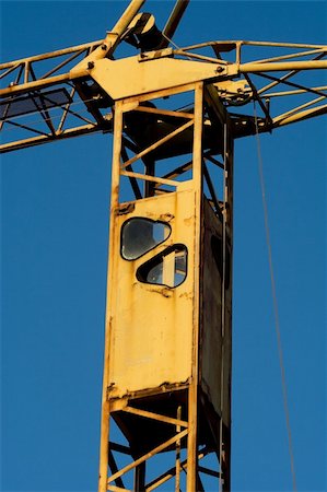 simsearch:400-05249204,k - Rusty crane cabin detail over clean blue sky Stock Photo - Budget Royalty-Free & Subscription, Code: 400-05014103
