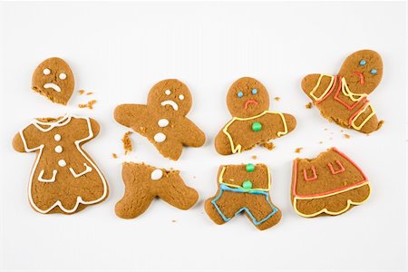 Four frowning male and female gingerbread cookies broken into pieces. Stock Photo - Budget Royalty-Free & Subscription, Code: 400-05014145