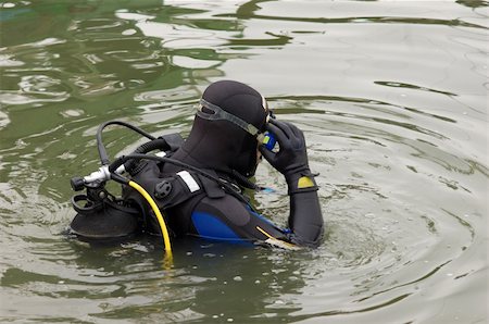 diver in the suit - Scuba diver in wet suit entering the cold water Stock Photo - Budget Royalty-Free & Subscription, Code: 400-05014554