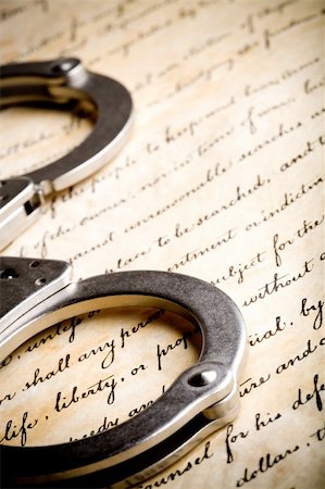 handcuffs closeup on United States Constitution with focus on Liberty Photographie de stock - Aubaine LD & Abonnement, Code: 400-05014570