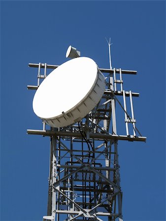 dish satellite tower - A Communications Aerial against a Blue Sky Stock Photo - Budget Royalty-Free & Subscription, Code: 400-05014781