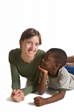 A series of images showing a young African American boy with a Caucasian woman. Isolated on white. Foto de stock - Royalty-Free Super Valor e Assinatura, Número: 400-05014910