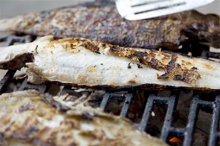 Fishes on grill close up photo Stock Photo - Budget Royalty-Free & Subscription, Code: 400-05014927