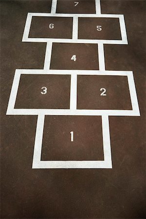 Children's hopscotch on playground concrete. Fotografie stock - Microstock e Abbonamento, Codice: 400-05015321