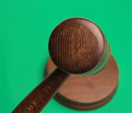simsearch:400-08624071,k - judge's gavel,close up over green background Stock Photo - Budget Royalty-Free & Subscription, Code: 400-05016775