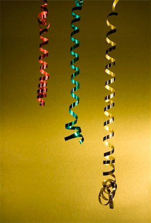 Sparkling tinsel streamers on a gold background, design element or background. Stock Photo - Budget Royalty-Free & Subscription, Code: 400-05016910