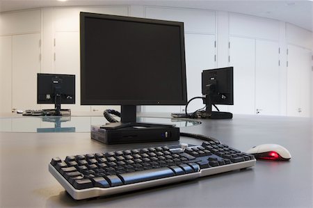 Three computers in a modern classroom Stock Photo - Budget Royalty-Free & Subscription, Code: 400-05017224