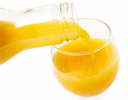 simsearch:400-04499805,k - Fresh orange juice pouring from the glass bottle to the glass Photographie de stock - Aubaine LD & Abonnement, Code: 400-05017634