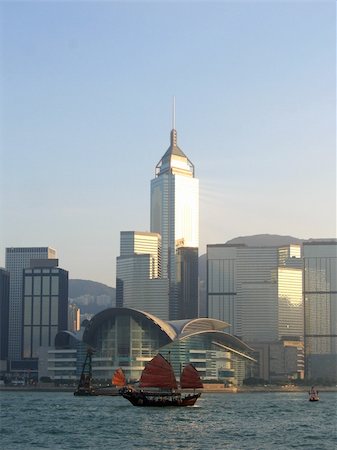 Sailing ship at Victoria Harbor. Taken from Kowloon looking across at the Hong Kong Convention and Exhibition Center Stock Photo - Budget Royalty-Free & Subscription, Code: 400-05017963