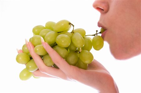 photo of model woman with grapes - A woman portrait taken in the studio tatsting grapes Stock Photo - Budget Royalty-Free & Subscription, Code: 400-05018715