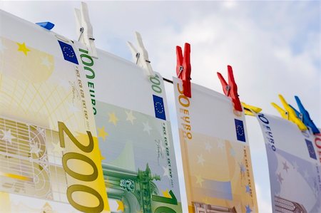 simsearch:693-06021294,k - Euro banknotes on a clothesline against cloudy sky Stock Photo - Budget Royalty-Free & Subscription, Code: 400-05018733