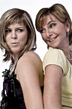 simsearch:400-04482792,k - A portrait taken from mother and daughter taken on a white background joking Stock Photo - Budget Royalty-Free & Subscription, Code: 400-05018814