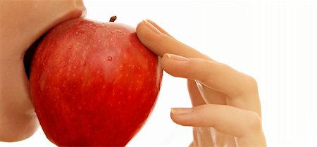 simsearch:400-05069103,k - Beautiful young woman eating red apple. Isolated over white Foto de stock - Super Valor sin royalties y Suscripción, Código: 400-05019243