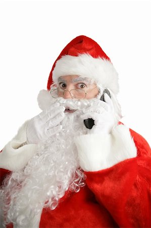 simsearch:400-05711921,k - Santa talking on his cellphone with a surprised look on his face.  Isolated on white. Stock Photo - Budget Royalty-Free & Subscription, Code: 400-05019514