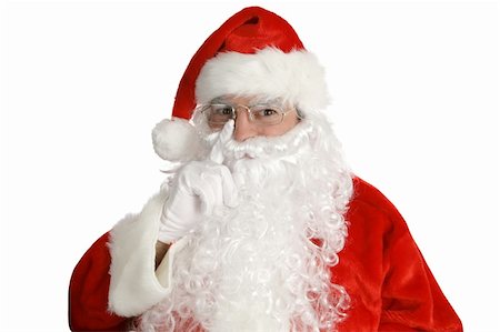 simsearch:400-04636742,k - Santa Laying his finger aside of his nose and giving a nod...  Isolated on white. Foto de stock - Royalty-Free Super Valor e Assinatura, Número: 400-05019516