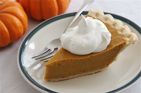 simsearch:400-04145790,k - A slice of pumpkin pie with whipped cream and a fork. Stock Photo - Budget Royalty-Free & Subscription, Code: 400-05019528