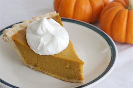 simsearch:400-04145790,k - A slice of pumpkin pie garnished with whipped cream. Stock Photo - Budget Royalty-Free & Subscription, Code: 400-05019529