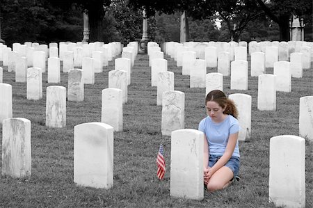 photography american military families - a young girl in a military cemetary honoring a fallen soldier  - selective colorization Stock Photo - Budget Royalty-Free & Subscription, Code: 400-05019578