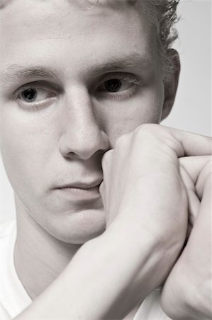 sad boy in black and white - Portrait of a young man in the studio thinking Stock Photo - Budget Royalty-Free & Subscription, Code: 400-05019898