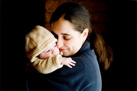 mother hugging and kissing her newborn baby, mother's love is the greatest love Photographie de stock - Aubaine LD & Abonnement, Code: 400-05010134